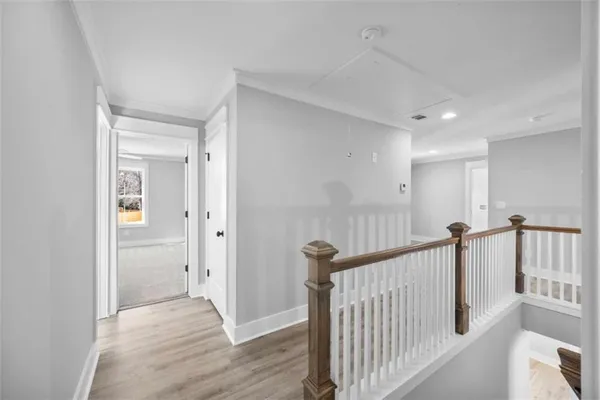 an empty room with closet and a ceiling fan