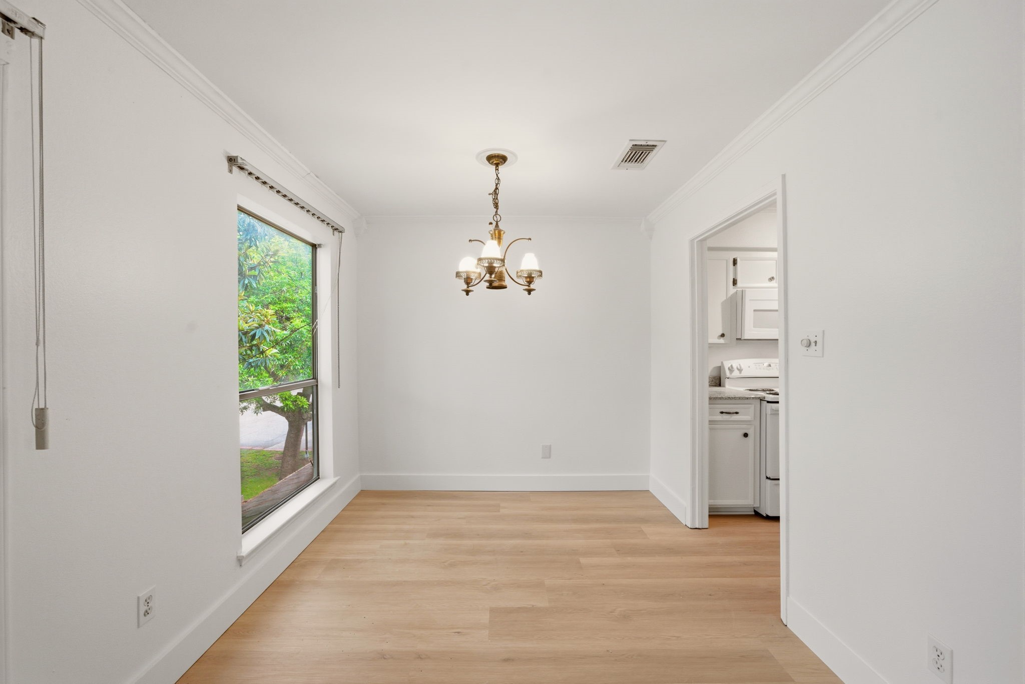 3 Hideaway Drive Friendswood, TX 77546 - Photo 7 of 15 wooden floor in an empty room with a window