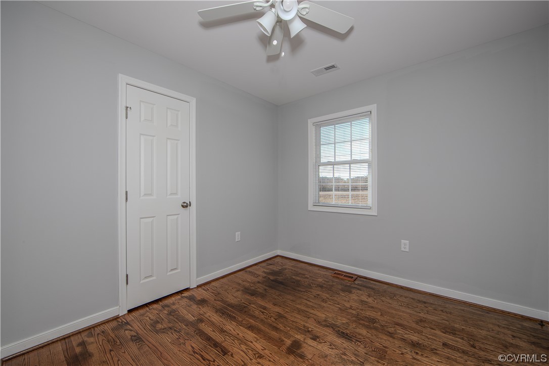 1001 Red House Road Ford, VA 23850 - Photo 14 of 20 a view of empty room with wooden floor and fan