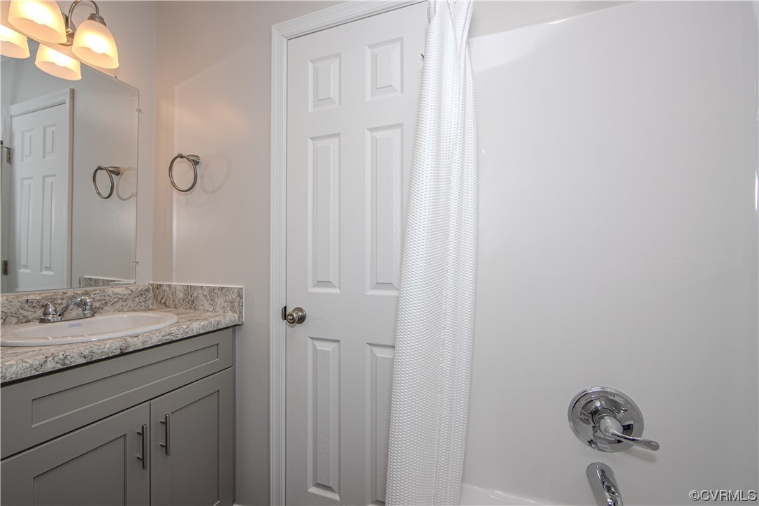 1001 Red House Road Ford, VA 23850 - Photo 16 of 20 a bathroom with a granite countertop sink and a mirror