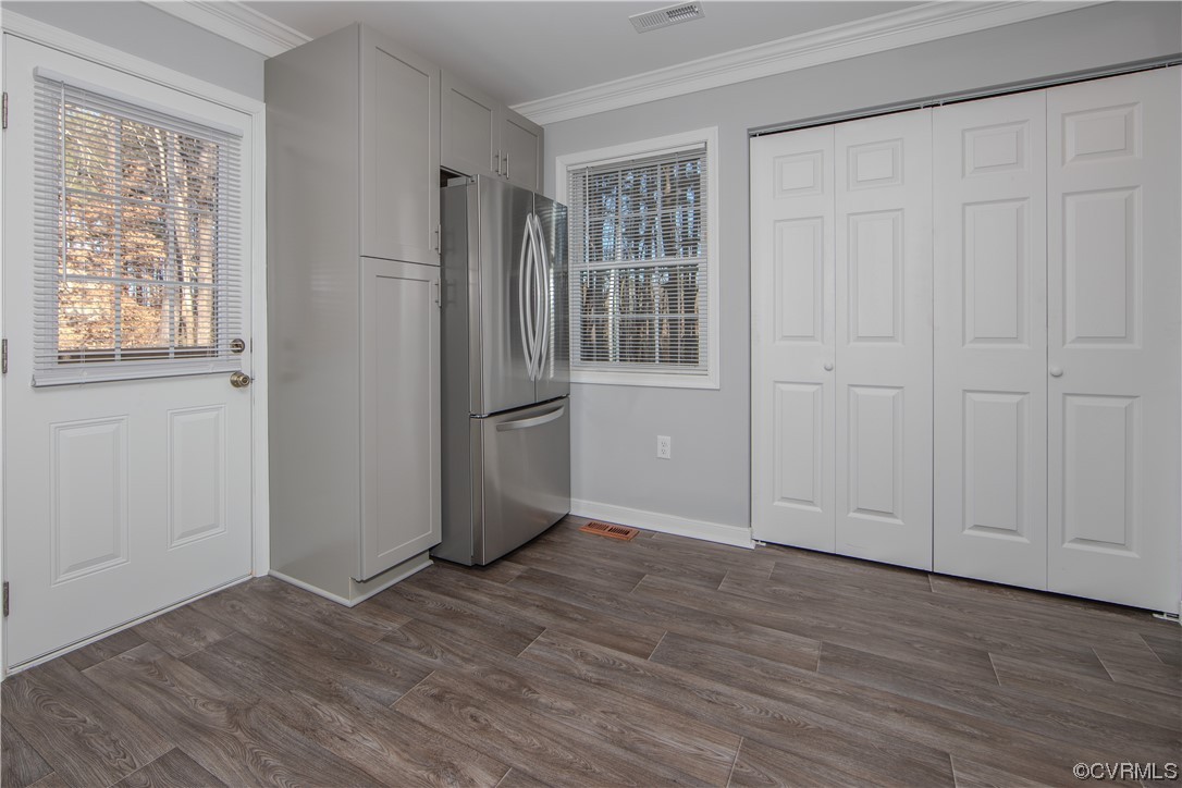 1001 Red House Road Ford, VA 23850 - Photo 5 of 20 an empty room with wooden floor cabinet and windows