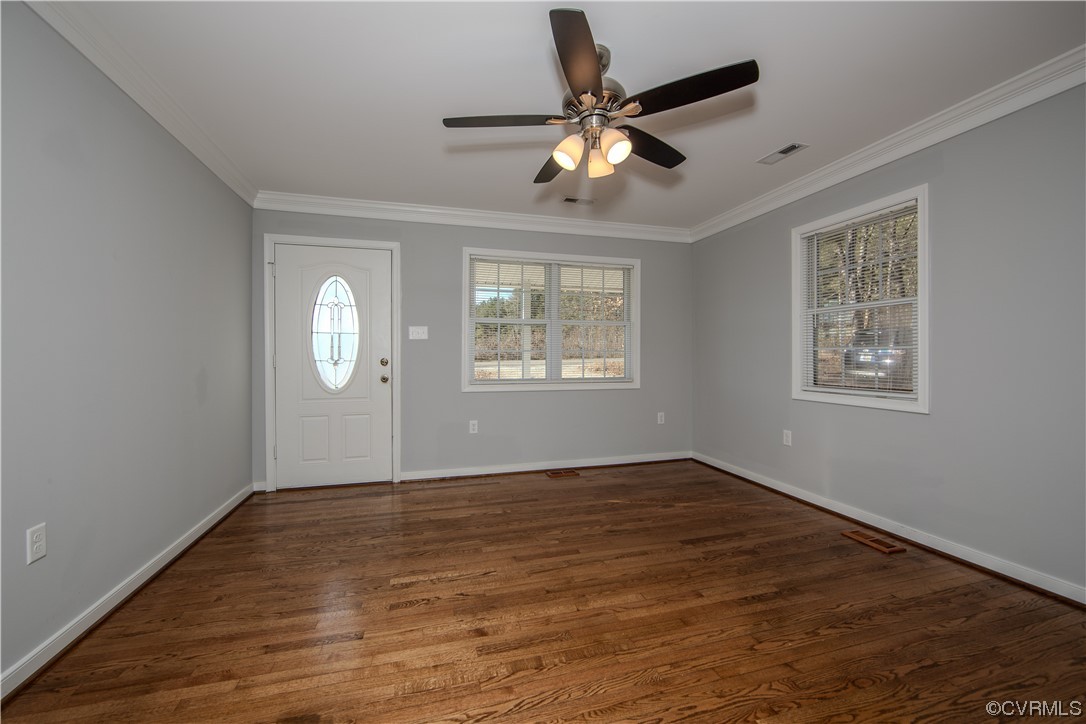 1001 Red House Road Ford, VA 23850 - Photo 6 of 20 a view of an empty room with wooden floor and a window
