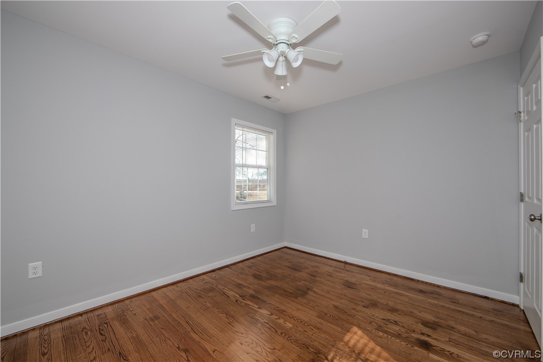 1001 Red House Road Ford, VA 23850 - Photo 9 of 20 wooden floor in an empty room with a window