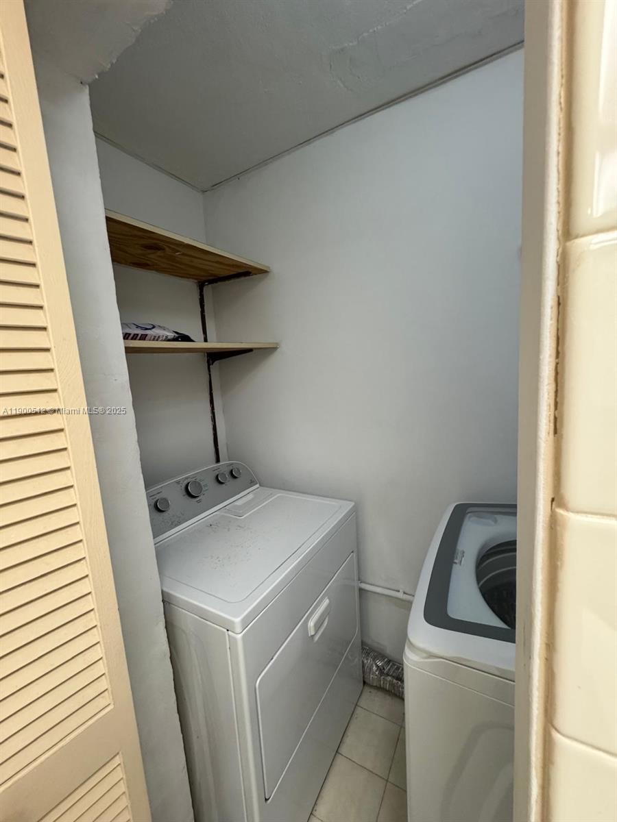 9155 Fontainebleau Boulevard, Unit 5 Miami, FL 33172 - Photo 15 of 18 a utility room with dryer and washer
