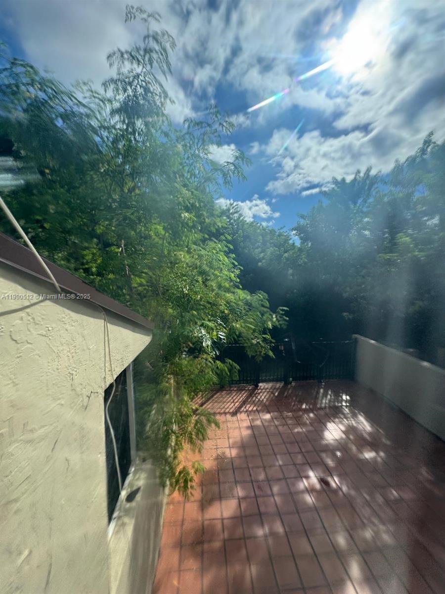 9155 Fontainebleau Boulevard, Unit 5 Miami, FL 33172 - Photo 18 of 18 a backyard of a house with lots of green space