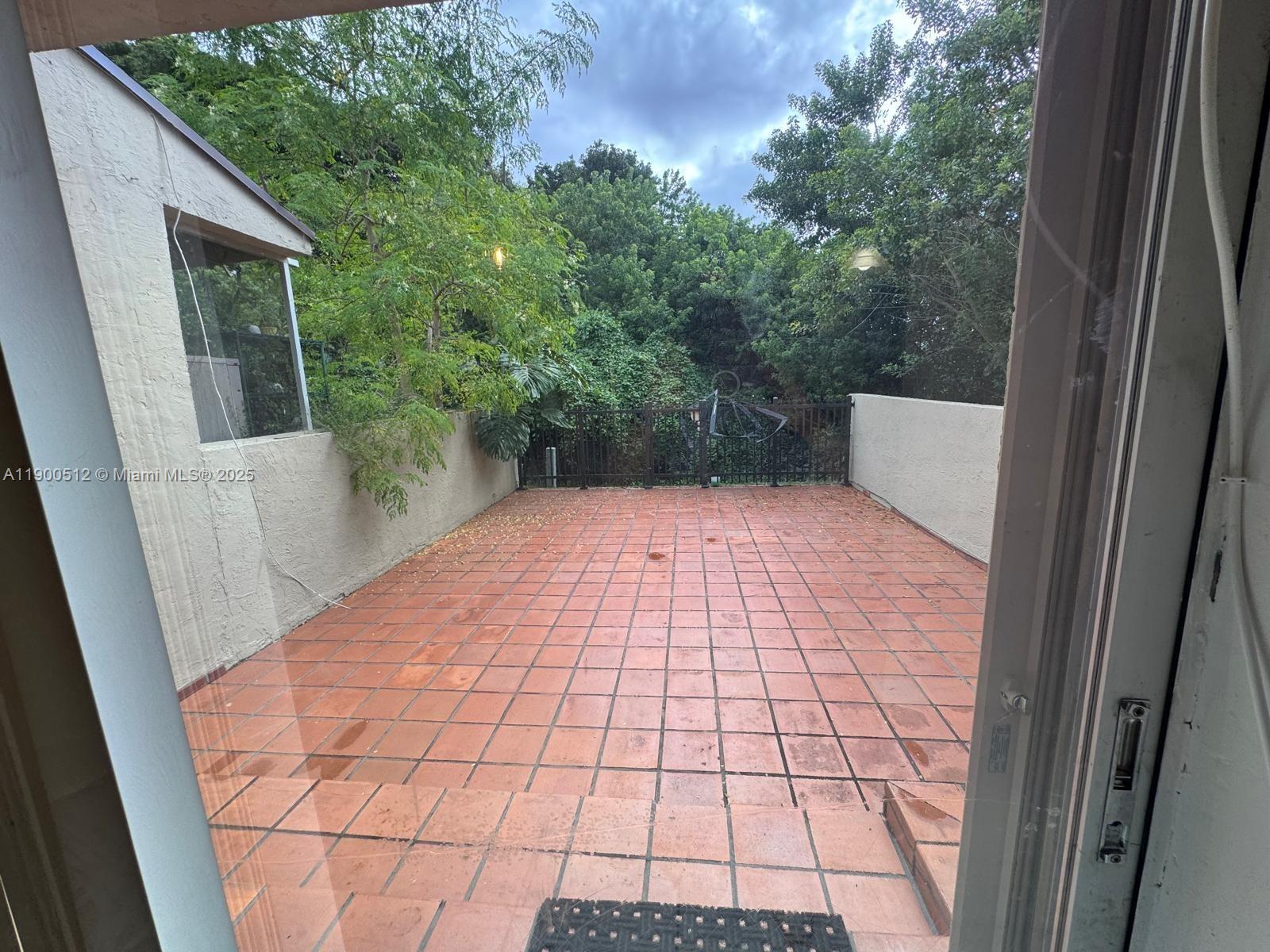 9155 Fontainebleau Boulevard, Unit 5 Miami, FL 33172 - Photo 4 of 18 a view of a backyard of the house