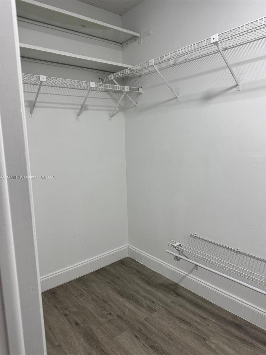 9155 Fontainebleau Boulevard, Unit 5 Miami, FL 33172 - Photo 7 of 18 a view of a room with racks on the wall