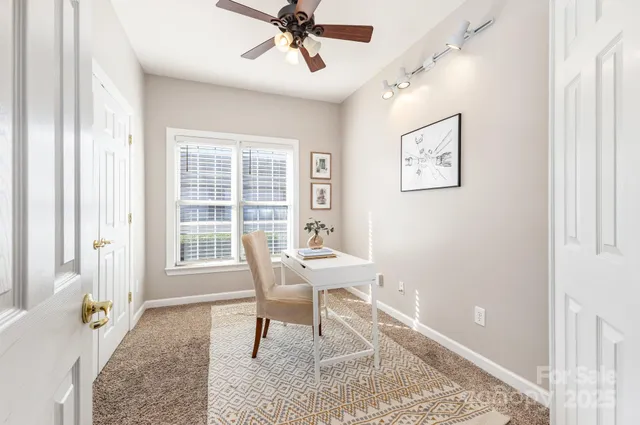 a workspace with furniture and window