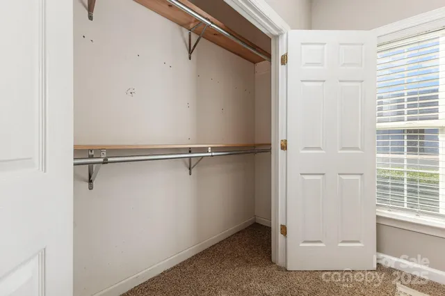 a view of a big room with windows