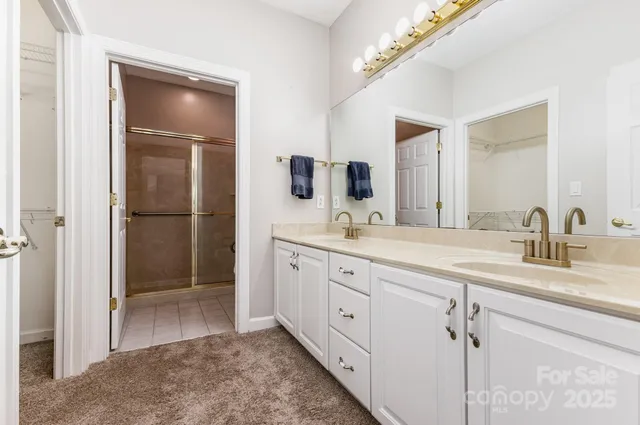 a white toilet sitting next to a shower
