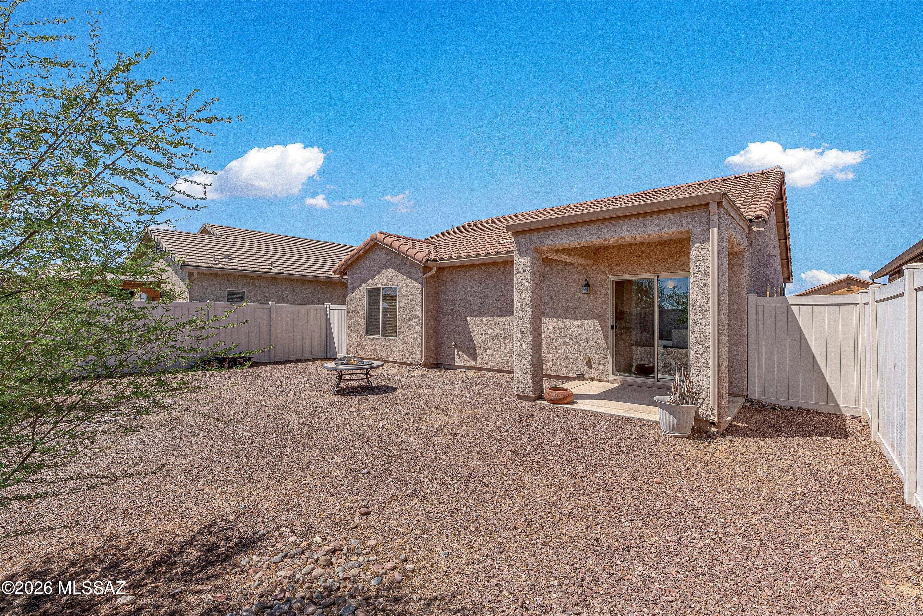 21163 East Treasure Road Red Rock, AZ 85145 - Photo 26 of 35 a view of a house with a patio and backyard