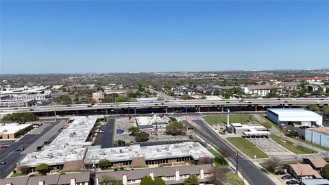 an aerial view of a house with outdoor space