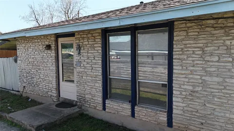 a view of a door with a bench
