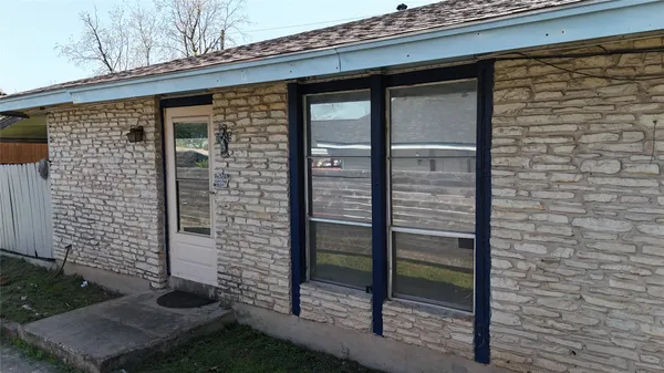 a view of a door with a bench