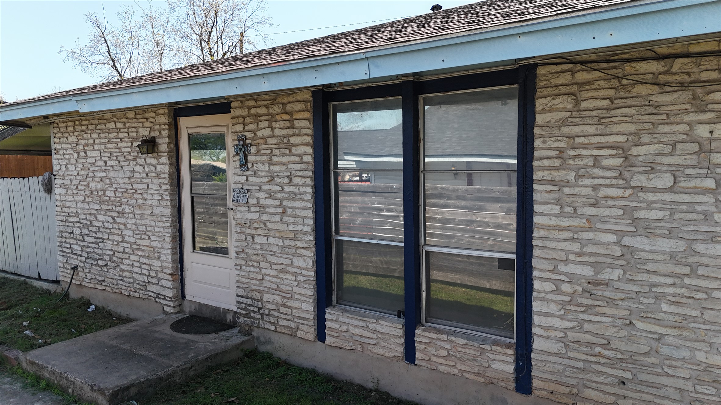 7702 Northcrest Boulevard Austin, TX 78752 - Photo 2 of 18 Property entrance with stone siding