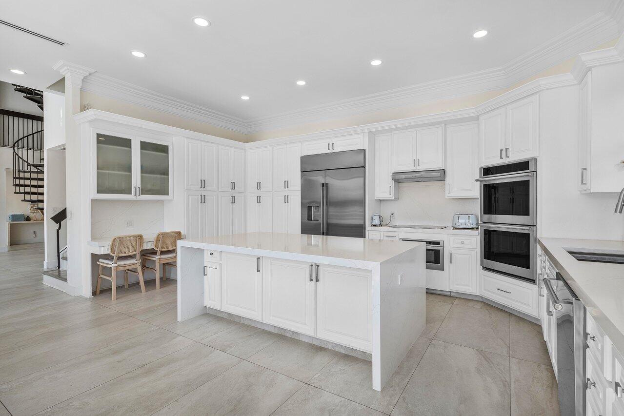 1536 Southwest 5th Avenue Boca Raton, FL 33432 - Photo 15 of 37 a large white kitchen with cabinets