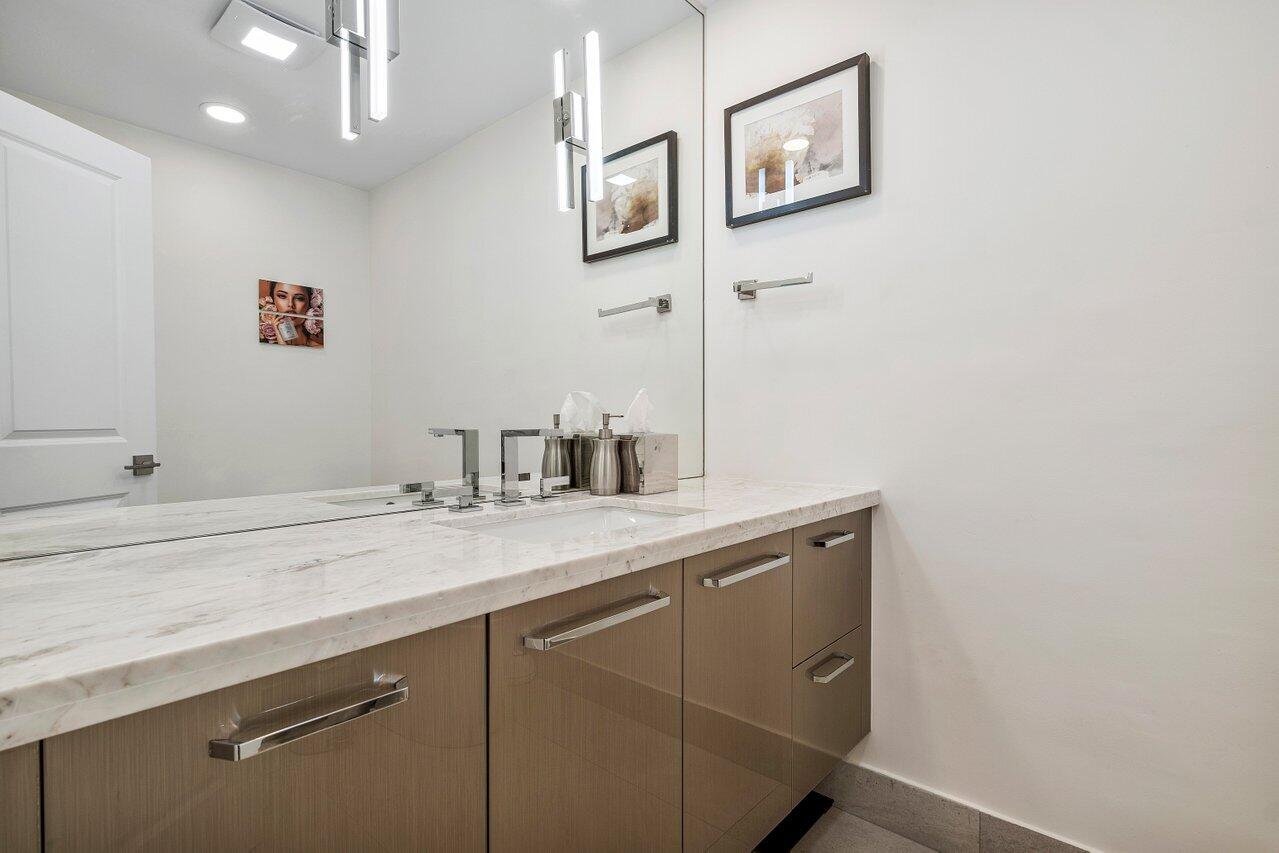 1536 Southwest 5th Avenue Boca Raton, FL 33432 - Photo 16 of 37 a bathroom with a sink and a mirror