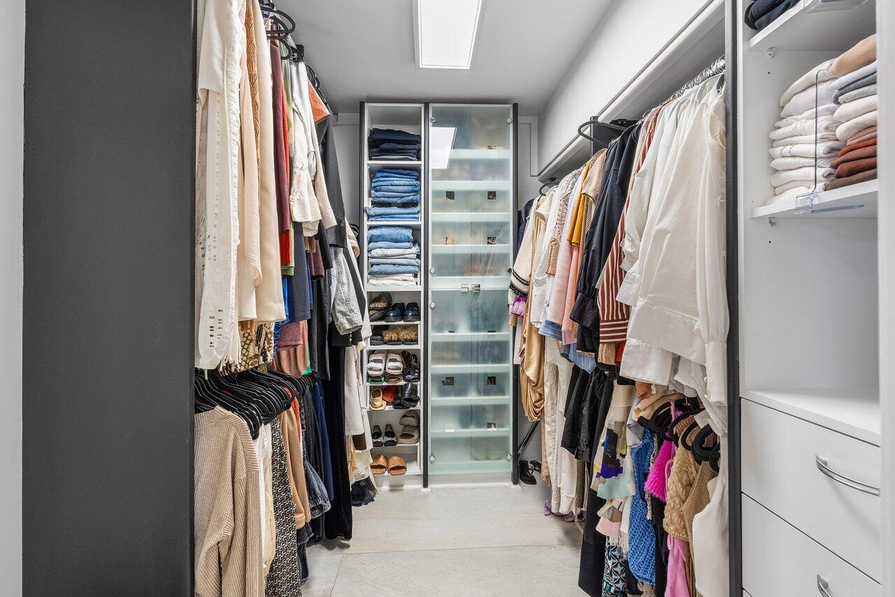 1536 Southwest 5th Avenue Boca Raton, FL 33432 - Photo 22 of 37 a view of walk in closet with clothes and shoes