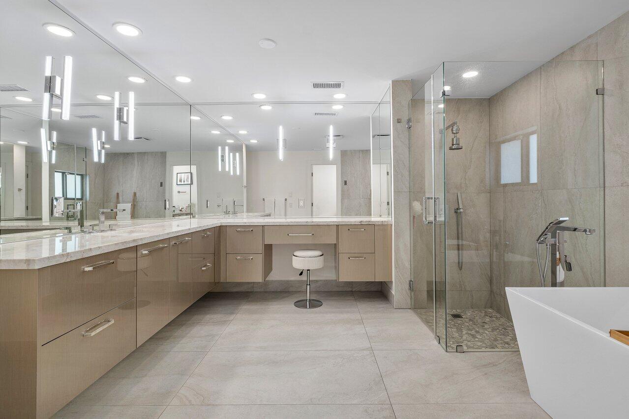 1536 Southwest 5th Avenue Boca Raton, FL 33432 - Photo 25 of 37 a large bathroom with a large tub shower sink vanity and toilet