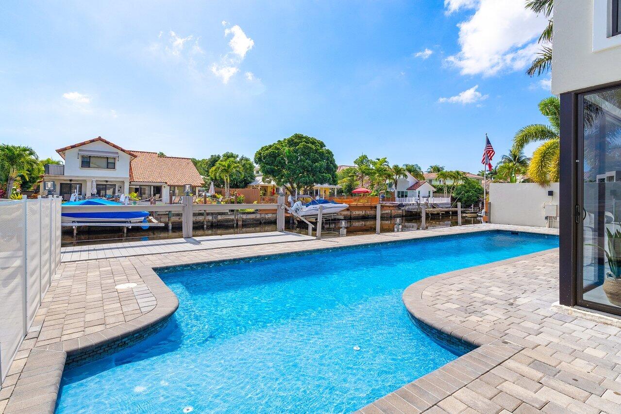 1536 Southwest 5th Avenue Boca Raton, FL 33432 - Photo 5 of 37 a view of a swimming pool with lounge chair