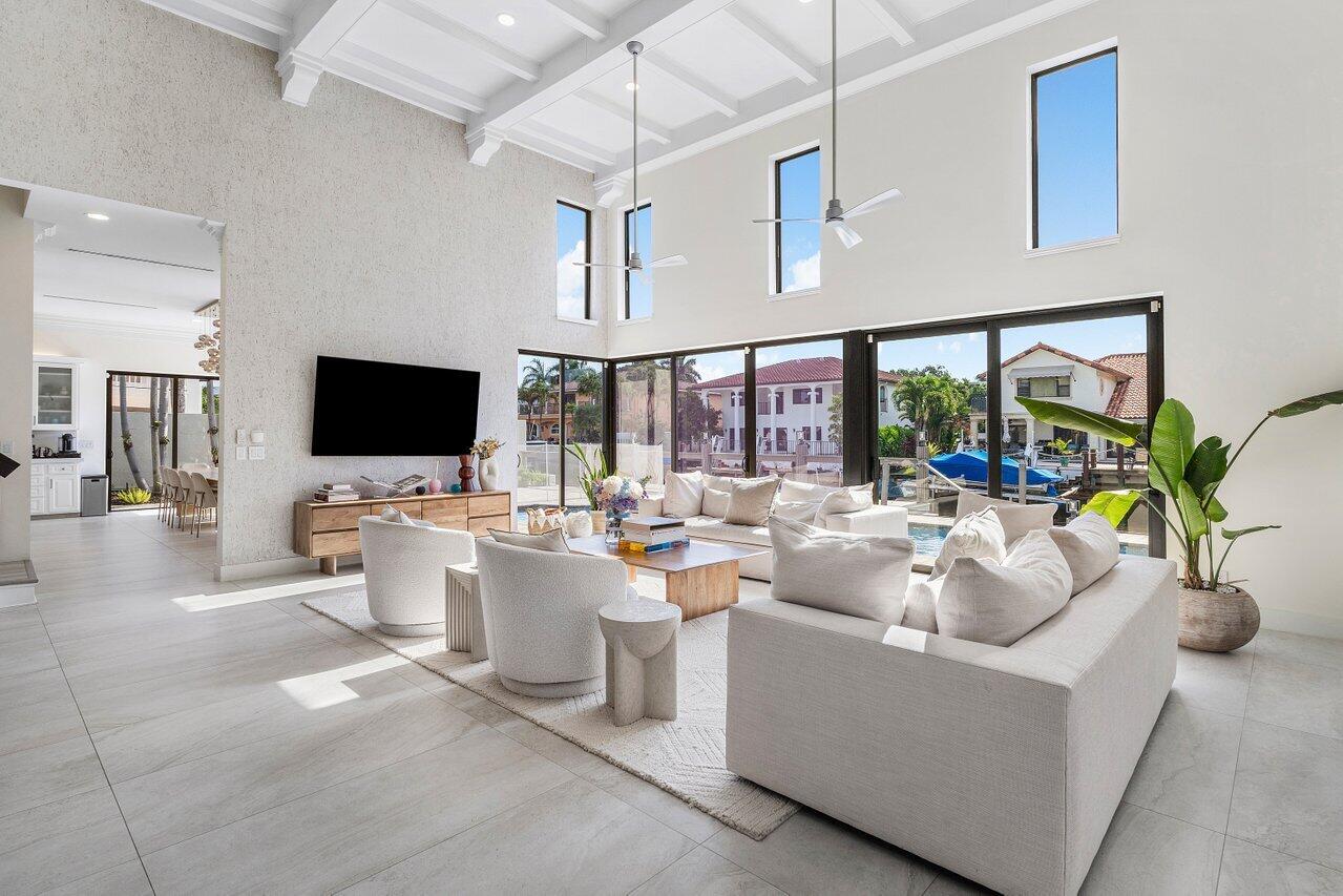 1536 Southwest 5th Avenue Boca Raton, FL 33432 - Photo 9 of 37 a living room with fireplace furniture and a flat screen tv