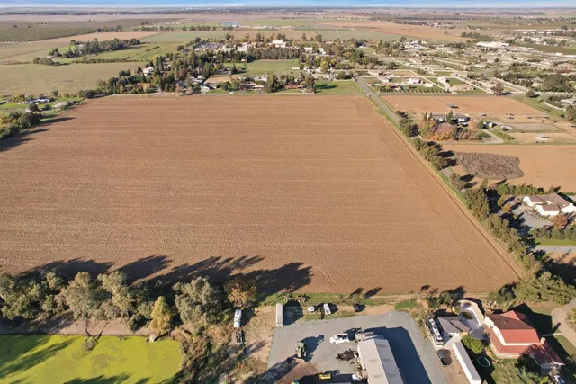 an aerial view of a city with ocean view