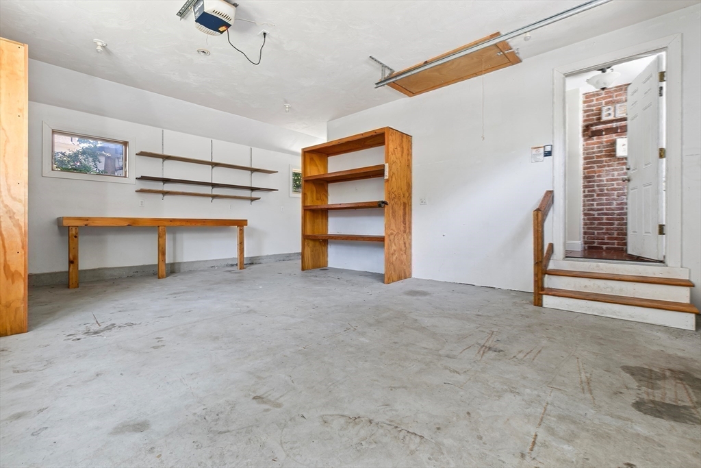27 May Street Marblehead, MA 01945 - Photo 27 of 34 a view of an empty room with a fireplace
