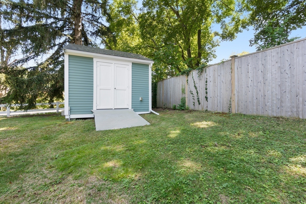 27 May Street Marblehead, MA 01945 - Photo 29 of 34 a view of backyard with potted plants and a large tree