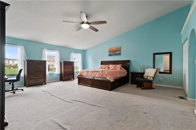 a bedroom with bed and window