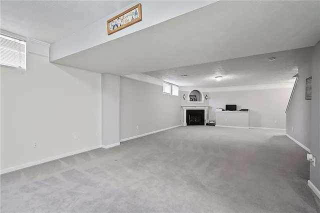 a view of a livingroom and a fireplace