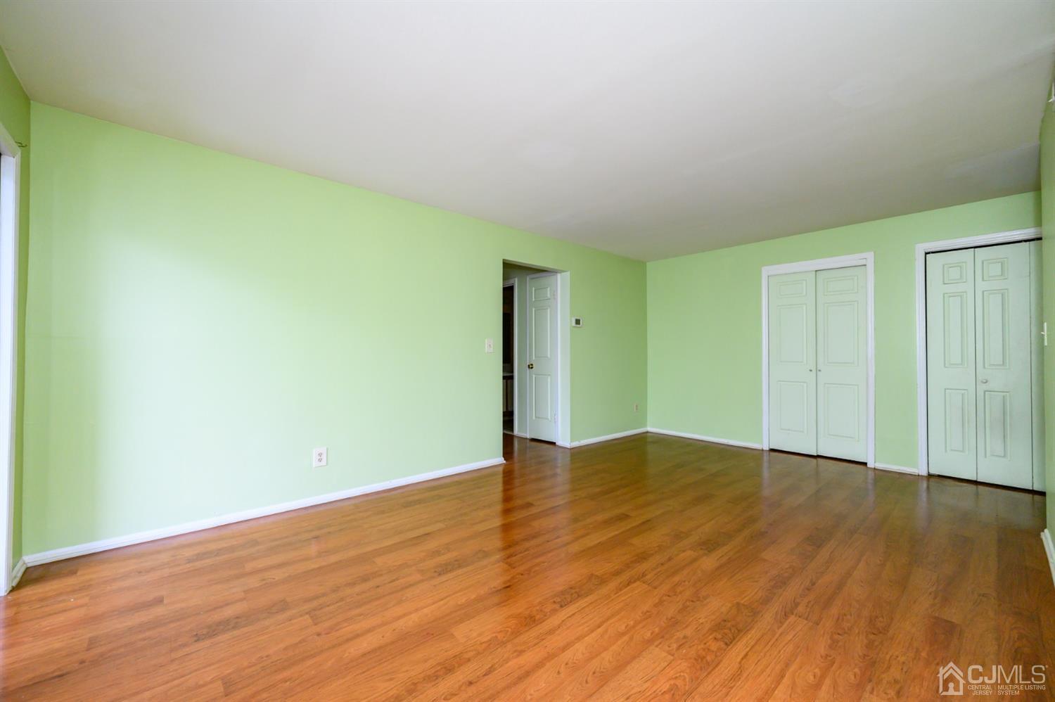 44 Boulder Drive Edison, NJ 08817 - Photo 11 of 21 a view of an empty room with wooden floor