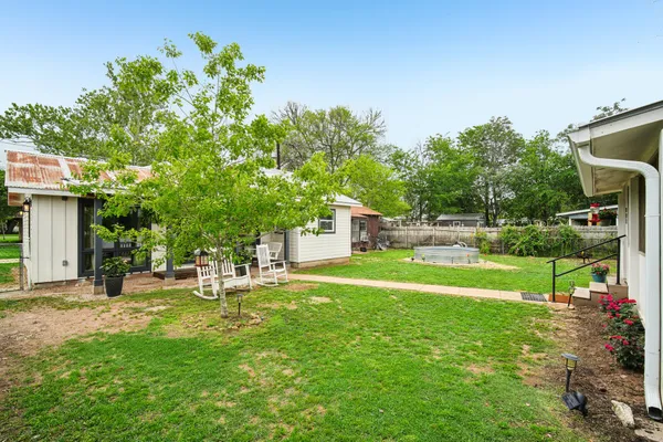 a view of a house with a back yard