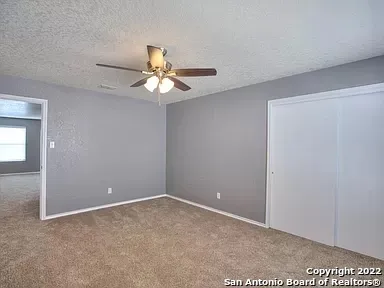 a view of a big room with carpet
