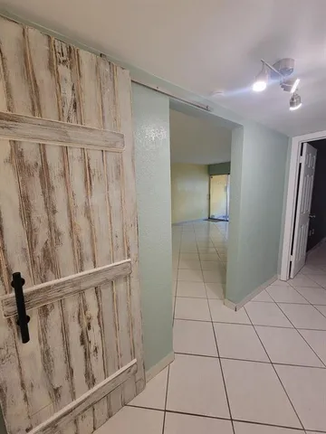 a bathroom with a shower sink vanity and toilet