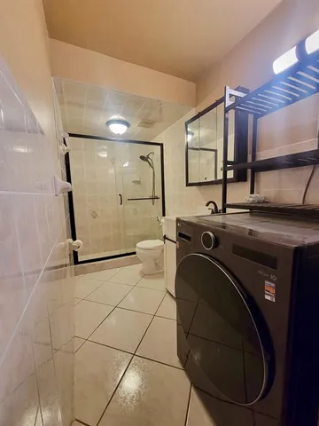 a view of a bathroom with a tub and a sink