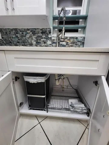 a kitchen with appliances and cabinets