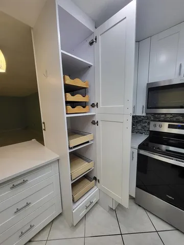 a view of storage and utility room with washer and dryer