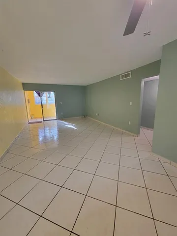 a view of an empty room and window