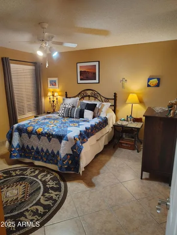 a bedroom with bed and window