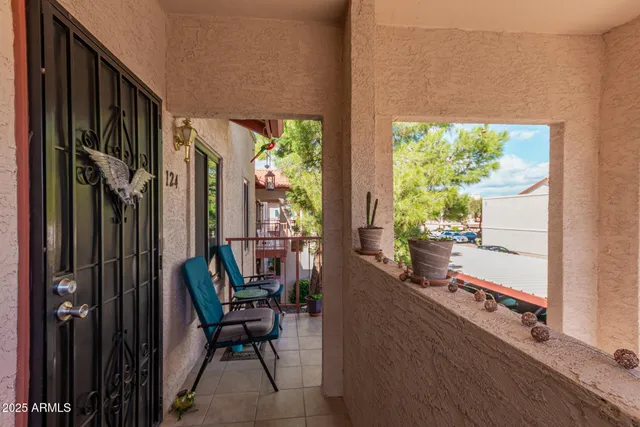 a view of a balcony with chairs
