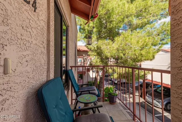 a view of balcony with furniture