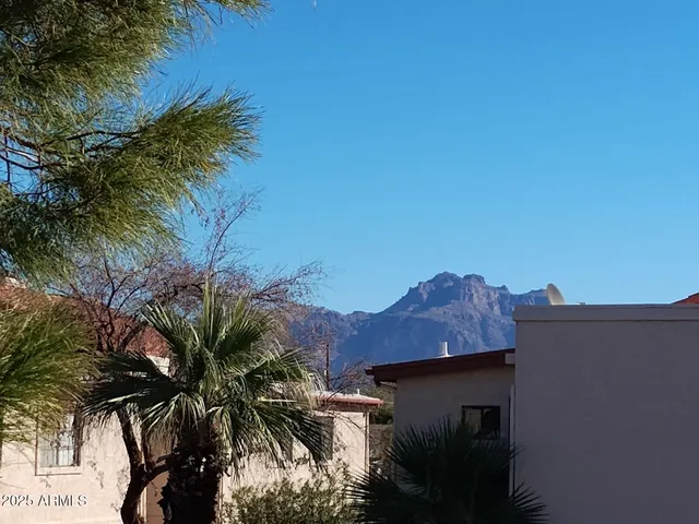 a view of a house with a small yard