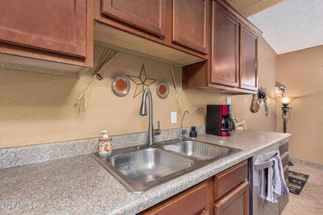 a kitchen with a sink and cabinets