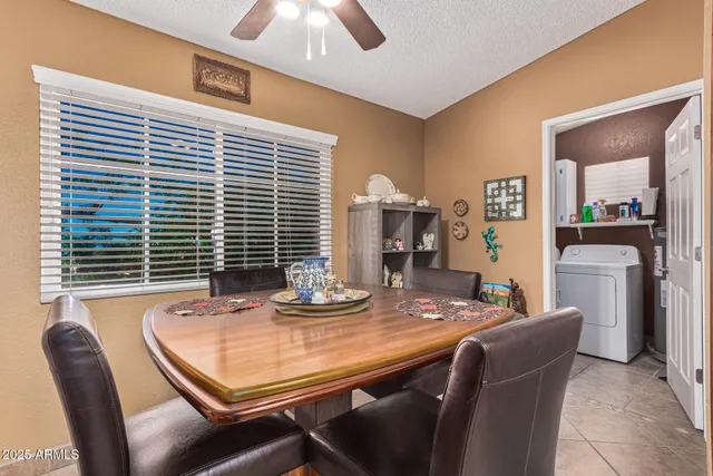 a dining room with furniture and window