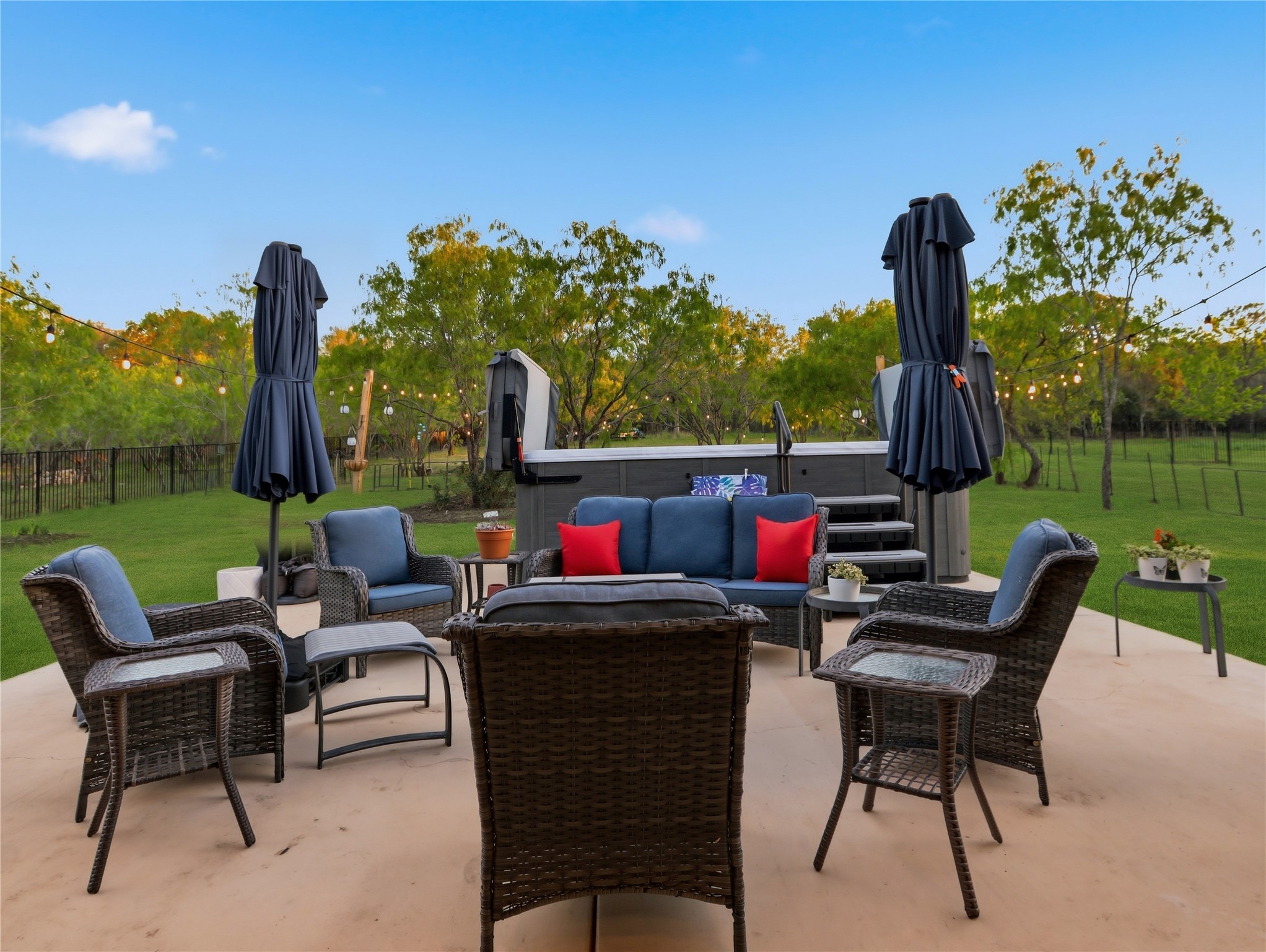 316 Raptor Beak Way Cedar Creek, TX 78612 - Photo 26 of 30 a view of a patio with a table chairs and a backyard