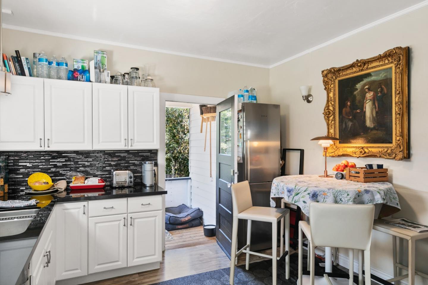 3 Ocean Avenue Carmel, CA 93921 - Photo 12 of 16 a kitchen with stainless steel appliances a refrigerator and a stove top oven