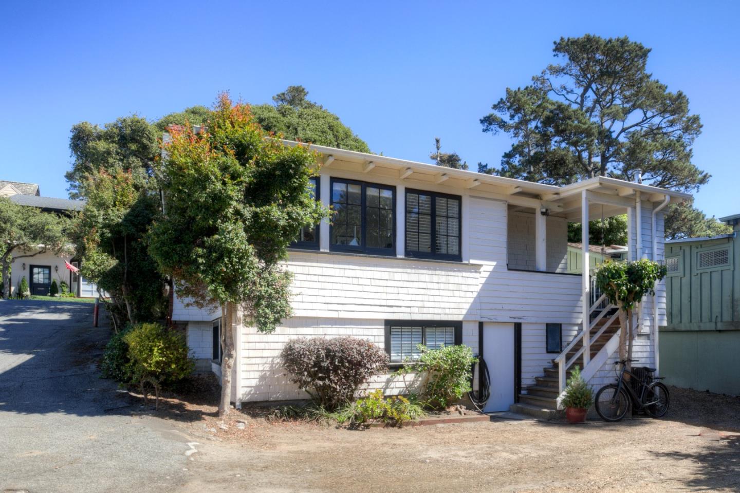 3 Ocean Avenue Carmel, CA 93921 - Photo 15 of 16 a house that has a tree in front of it