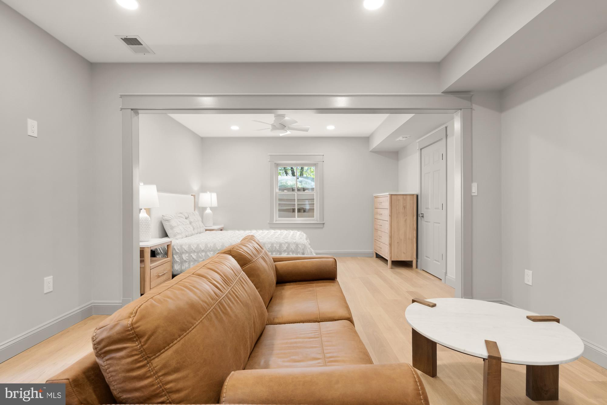 a living room with furniture and a window