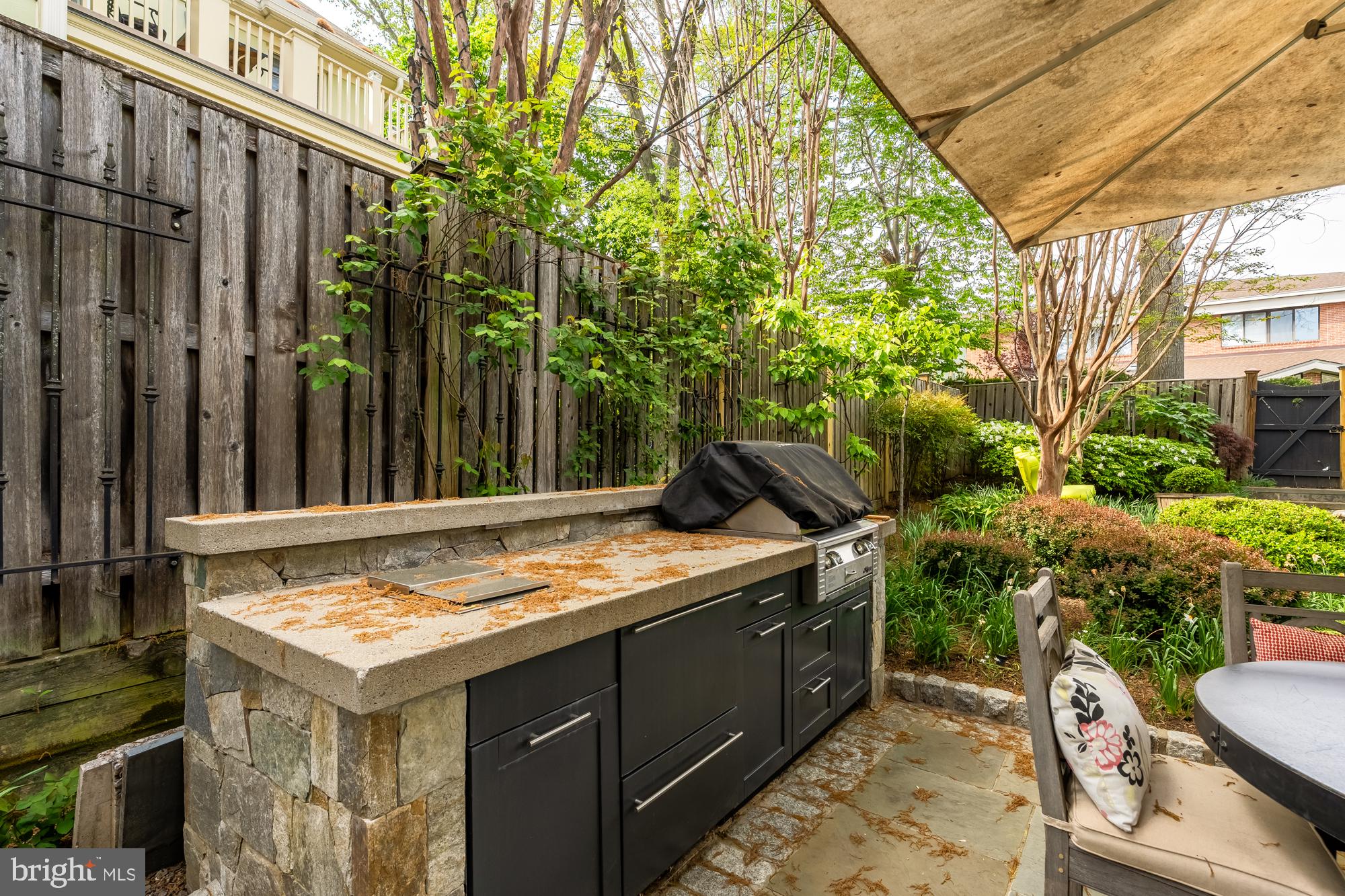 4111 18th Road North, Unit 1 Arlington, VA 22207 - Photo 15 of 16 a view of a chairs and table in a backyard