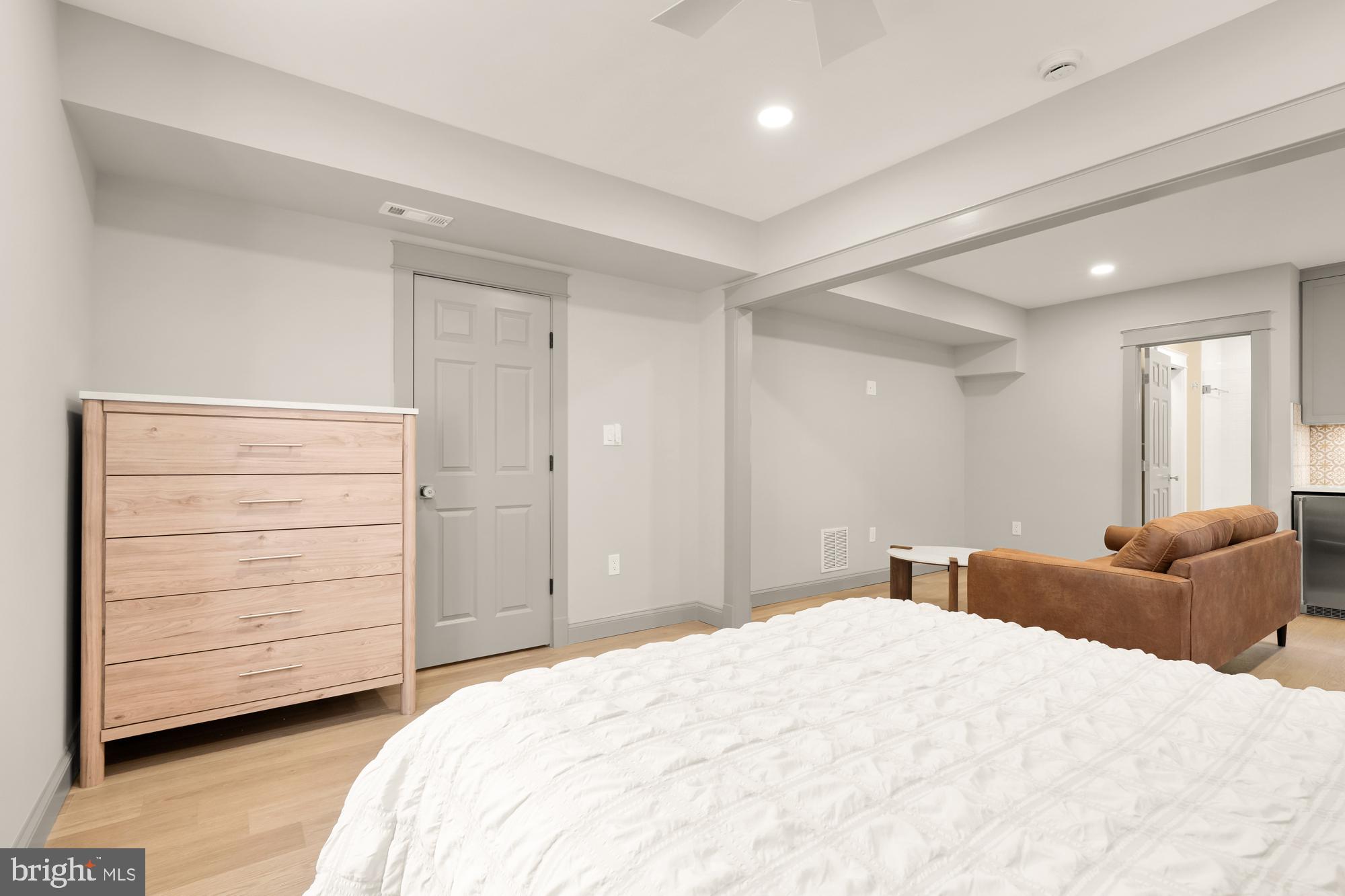 4111 18th Road North, Unit 1 Arlington, VA 22207 - Photo 8 of 16 a bedroom with a bed and a dresser